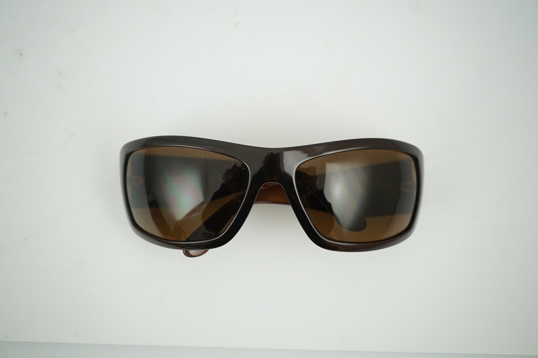 A pair of lady's brown Chanel sunglasses with hard case